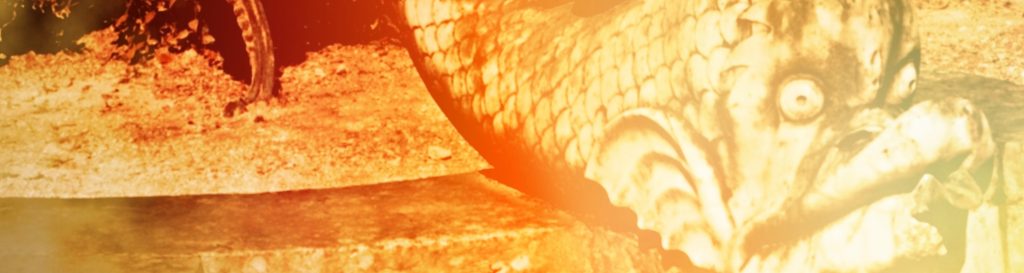 Photographie d'une statue en pierre d'un chérubin chevauchant un triton fantastique.