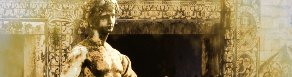 Photographie d'une statue en pierre au milieu d'un bassin d'un chanteur poète.