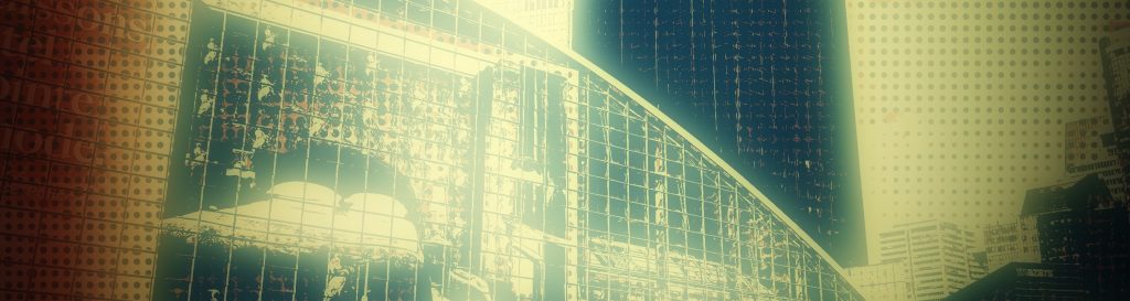 Photographie de la façade en verre en forme de demi-lune du CNIT de la Défense.