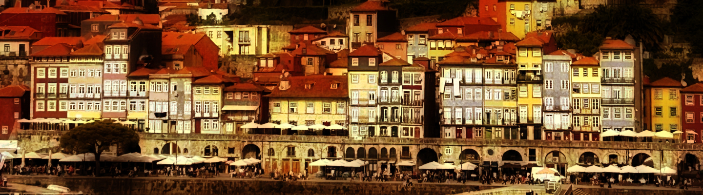 Photographie d'une vue de la ville de Porto. Le quai, les maisons traditionnelles hautes et étroites enchevêtrées.